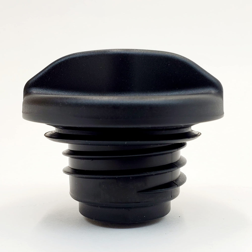 Billet Proof Designs cap under fuel door demonstrating compact size and correct clearance