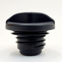 Billet Proof Designs cap under fuel door demonstrating compact size and correct clearance