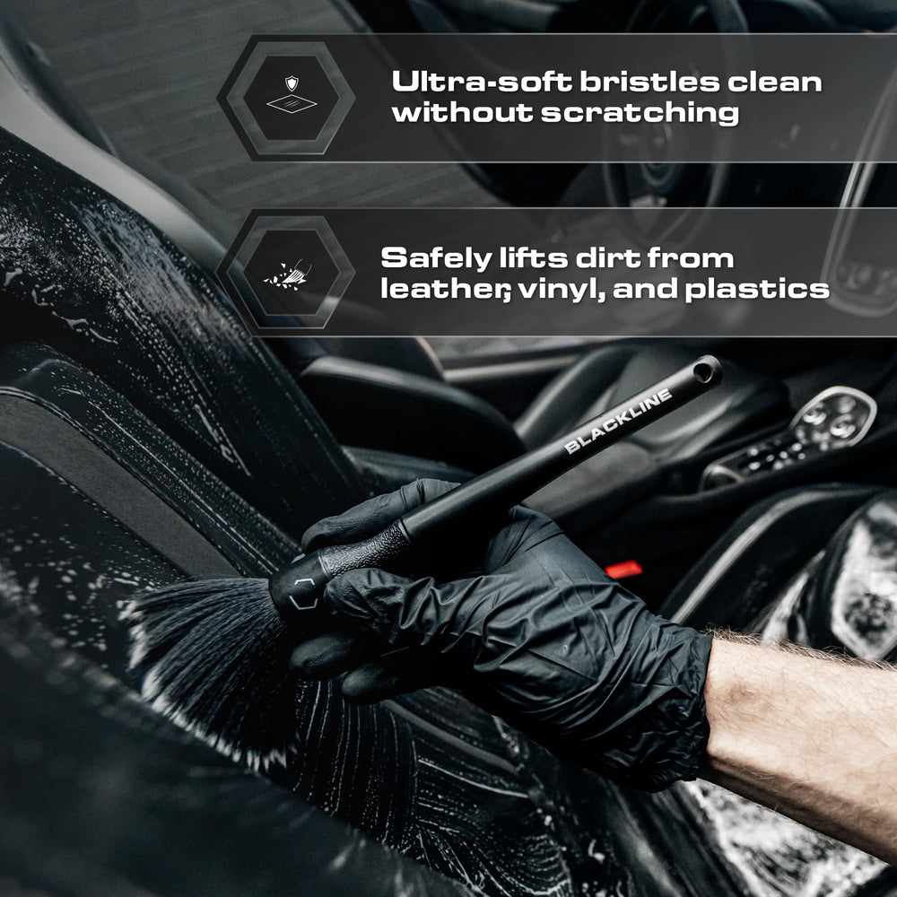 Blackline brush in use on dashboard vent demonstrating safe dirt removal