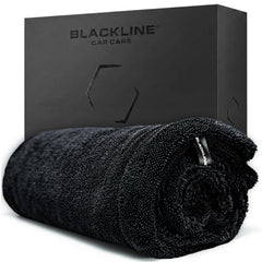 Blackline front view of towel folded showing size and label, clear sizing benefit