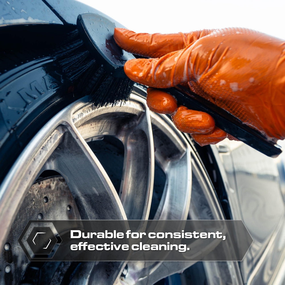 Blackline brush agitating a rubber floor mat to lift embedded dirt quickly