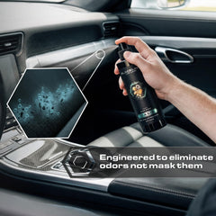 Hand spraying Blackline into vehicle demonstrating easy application benefit