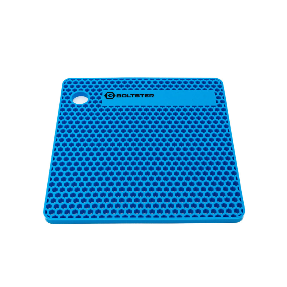 Boltster mat on workbench with tools showing durable workshop use