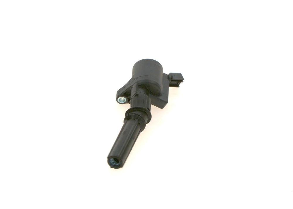 Bosch ignition coil held in hand showing compact size for easy handling