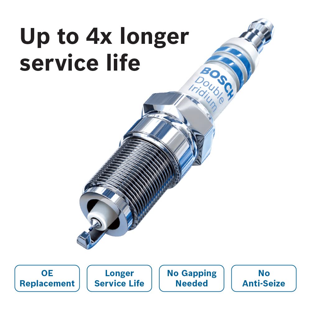 Bosch spark plug during car maintenance under open hood for dependable service