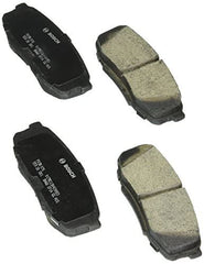 Bosch QuietCast ceramic pad close-up showing friction surface and MST shim for quieter stops