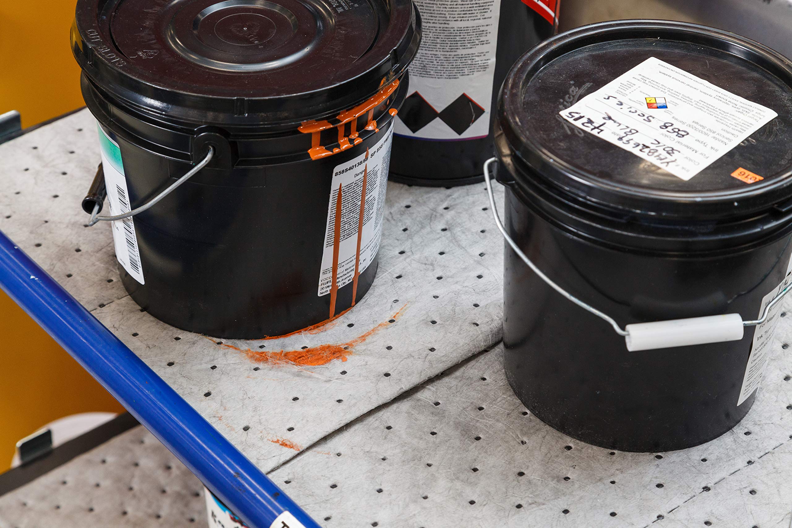 Brady pad absorbing machine drip on workbench to speed cleanup
