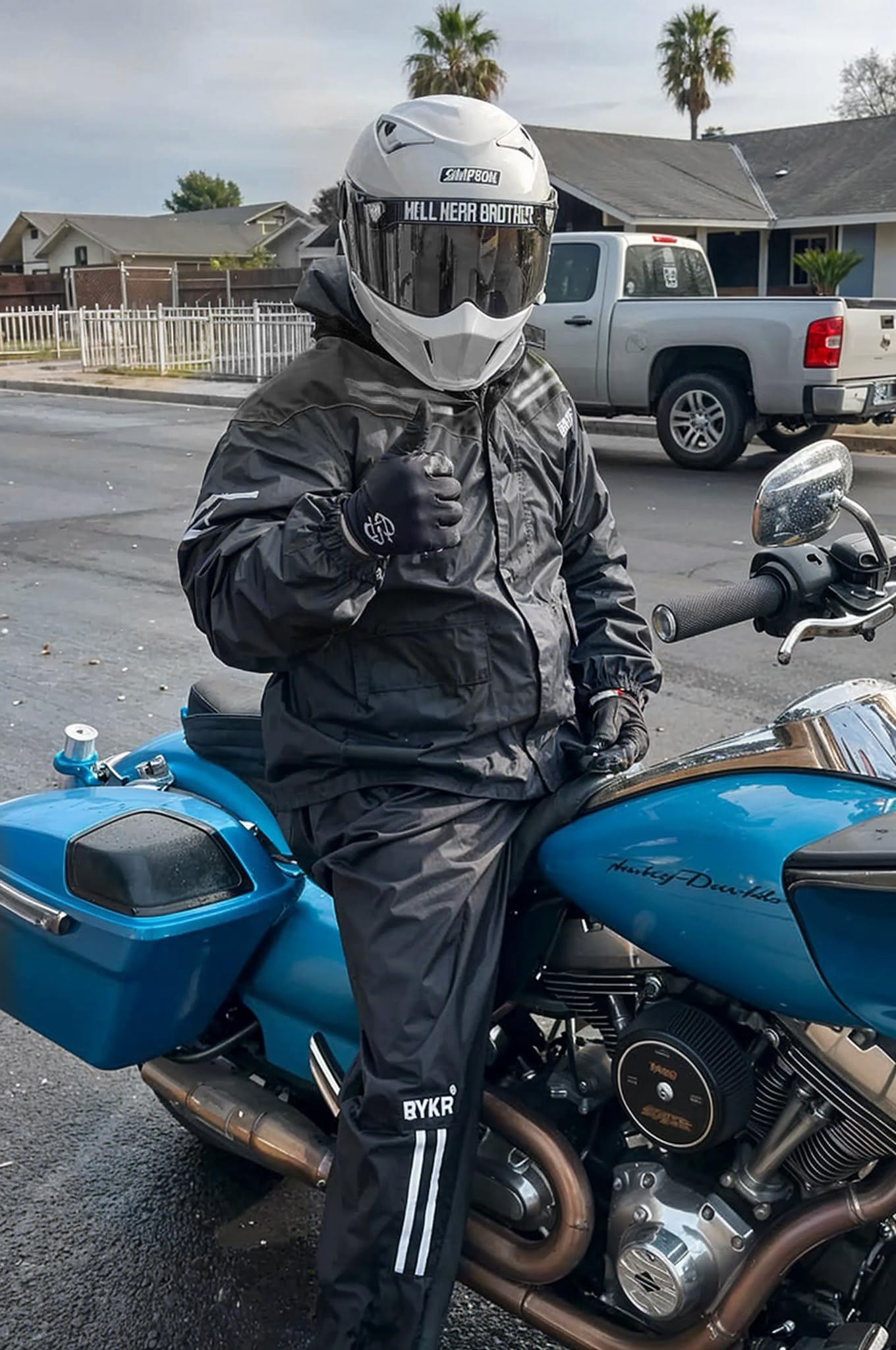 BYKR rider wearing suit in rain demonstrating wet-weather protection