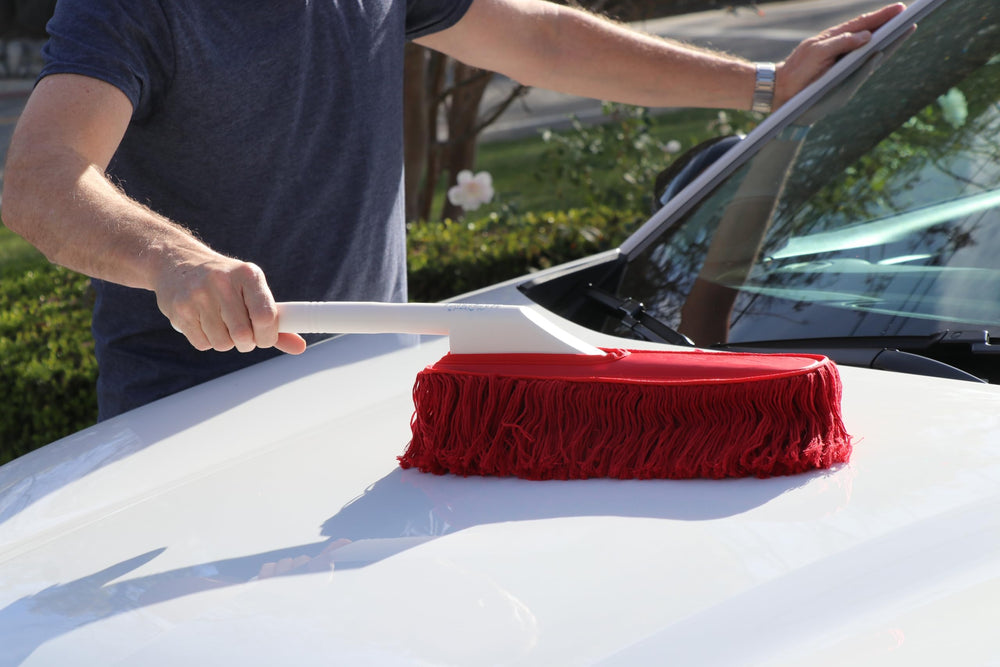 California Car Duster being shaken outside to remove loose debris and prolong life