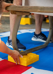 Camco block placed under RV wheel providing stable support