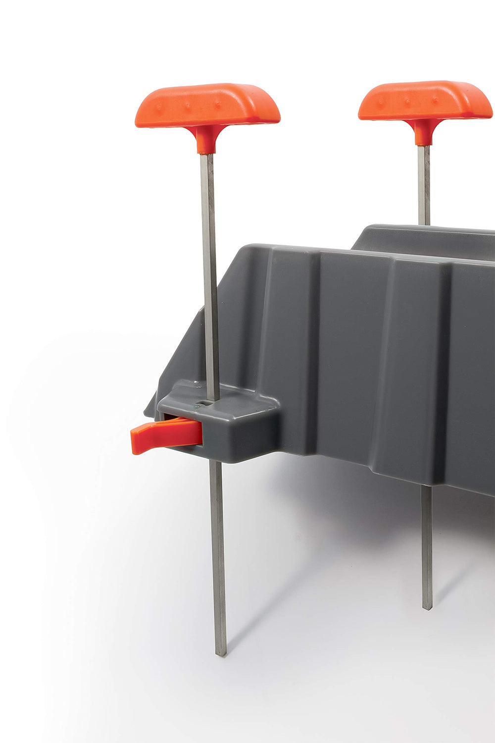 Camco Rhino next to RV wheel for scale to illustrate section length and height