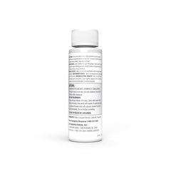 Camco TST MAX bottle being poured into an RV toilet for odor control
