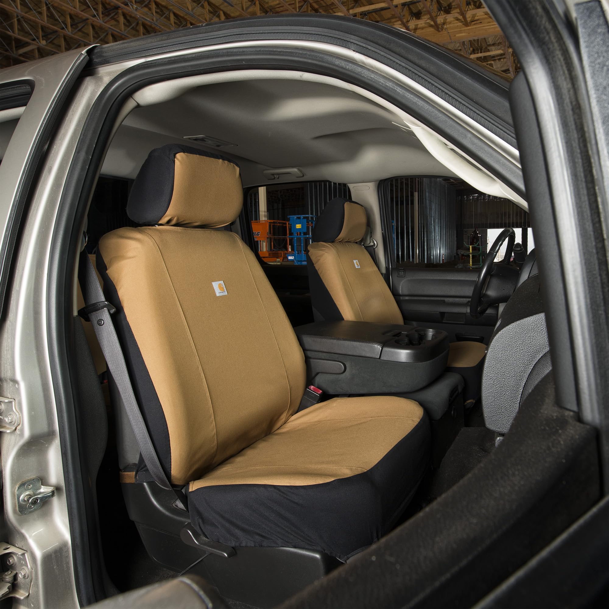 Carhartt seat cover beside ruler for scale showing fit for bucket seats and proper coverage