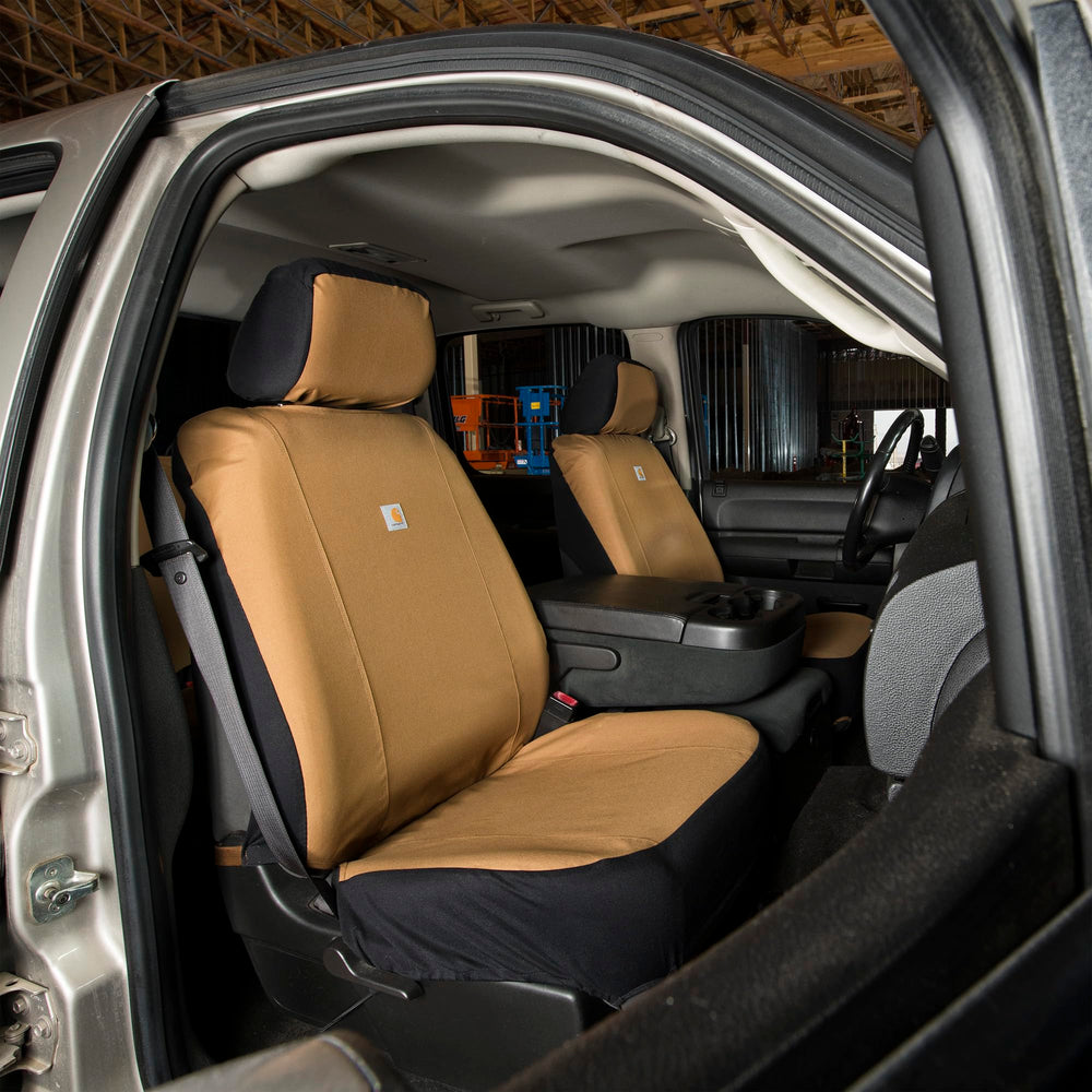 Carhartt seat cover beside ruler for scale showing fit for bucket seats and proper coverage