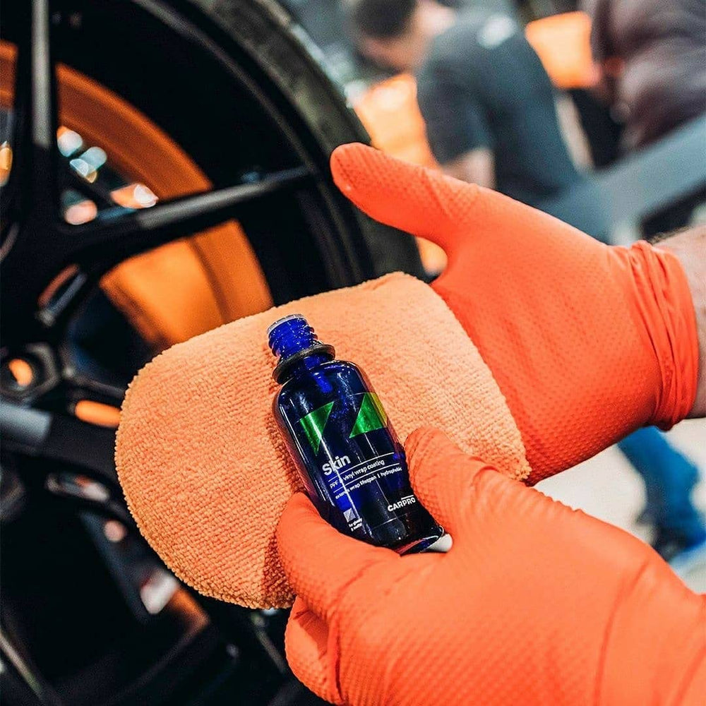 CARPRO CQUARTZ Skin being applied to a vinyl-wrapped panel for protection