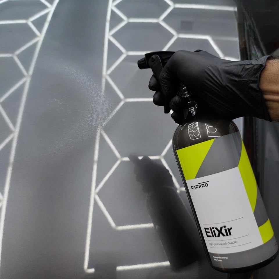 CARPRO EliXir being wiped with a microfiber to restore gloss quickly