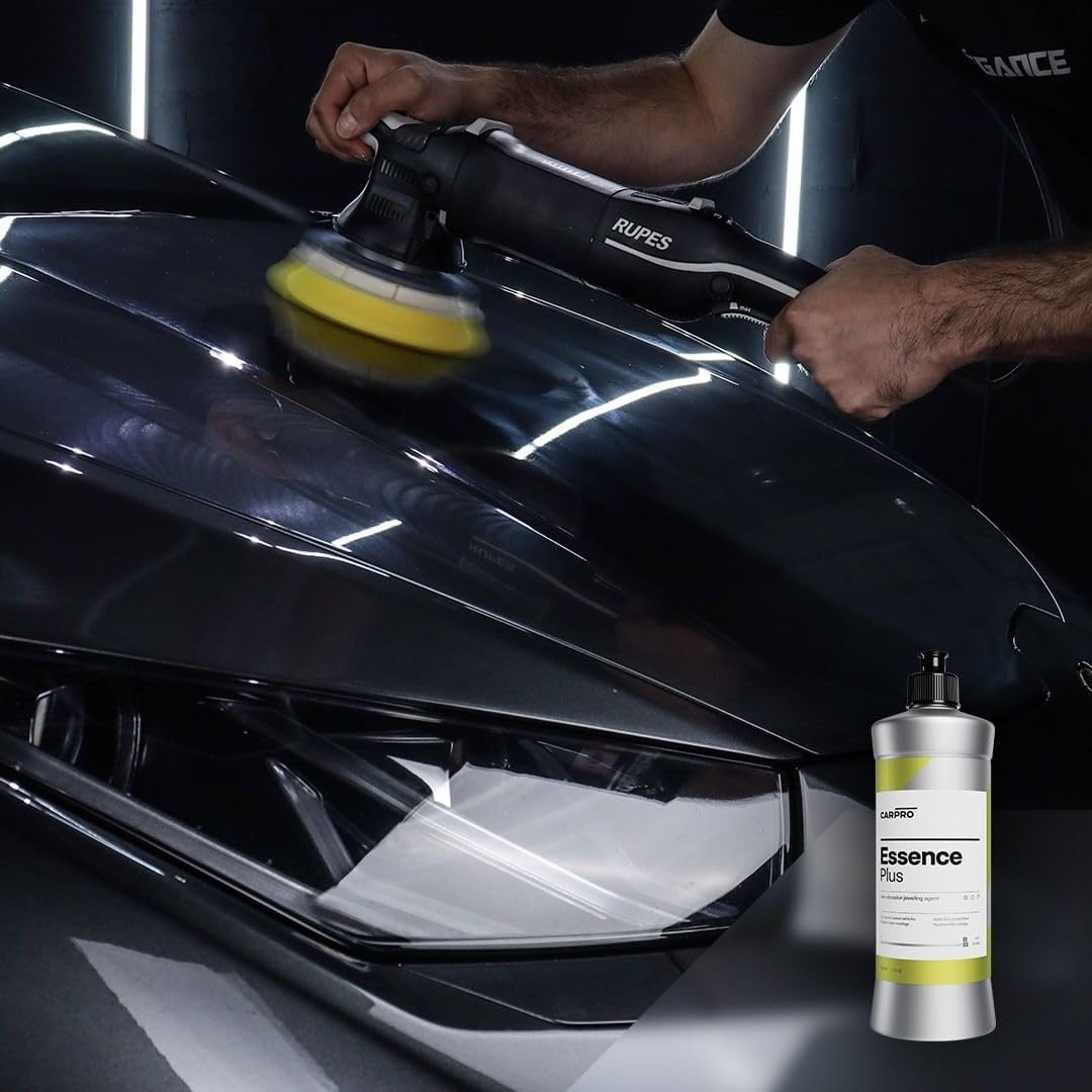 Hand holding CARPRO Essence PLUS bottle demonstrating easy application