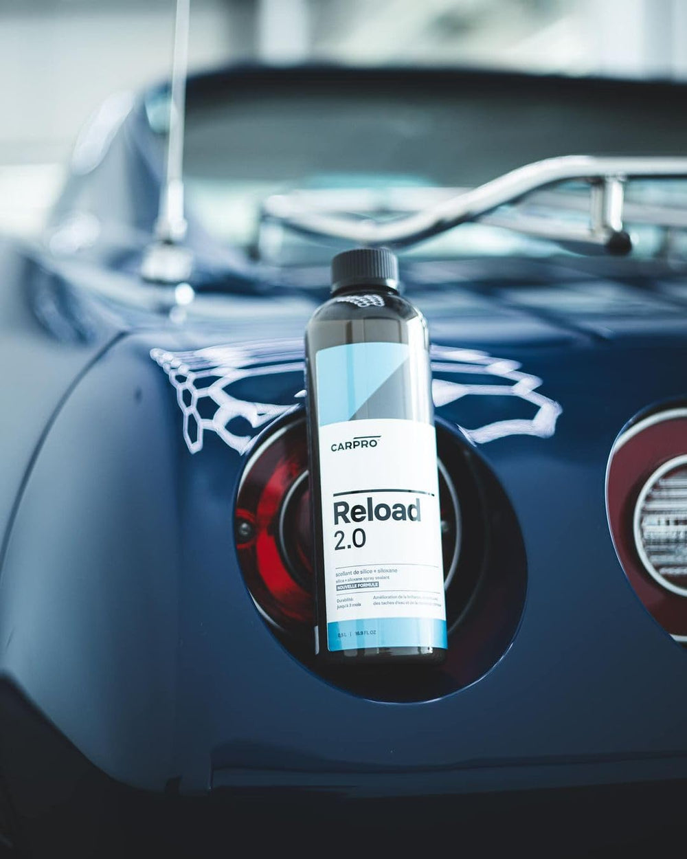 CARPRO Reload 2.0 bottle held next to hand showing 500mL scale and convenient size benefit