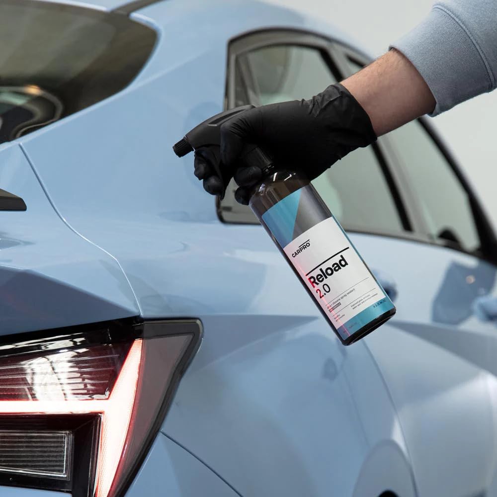 CARPRO Reload being wiped with a microfiber demonstrating smooth application and buffing