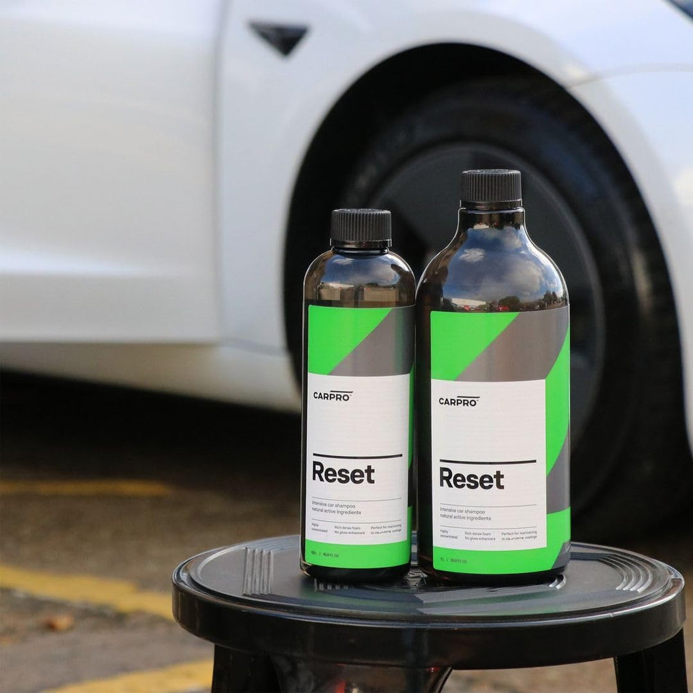 CARPRO Reset bottle beside a spray bottle for visible size comparison benefit