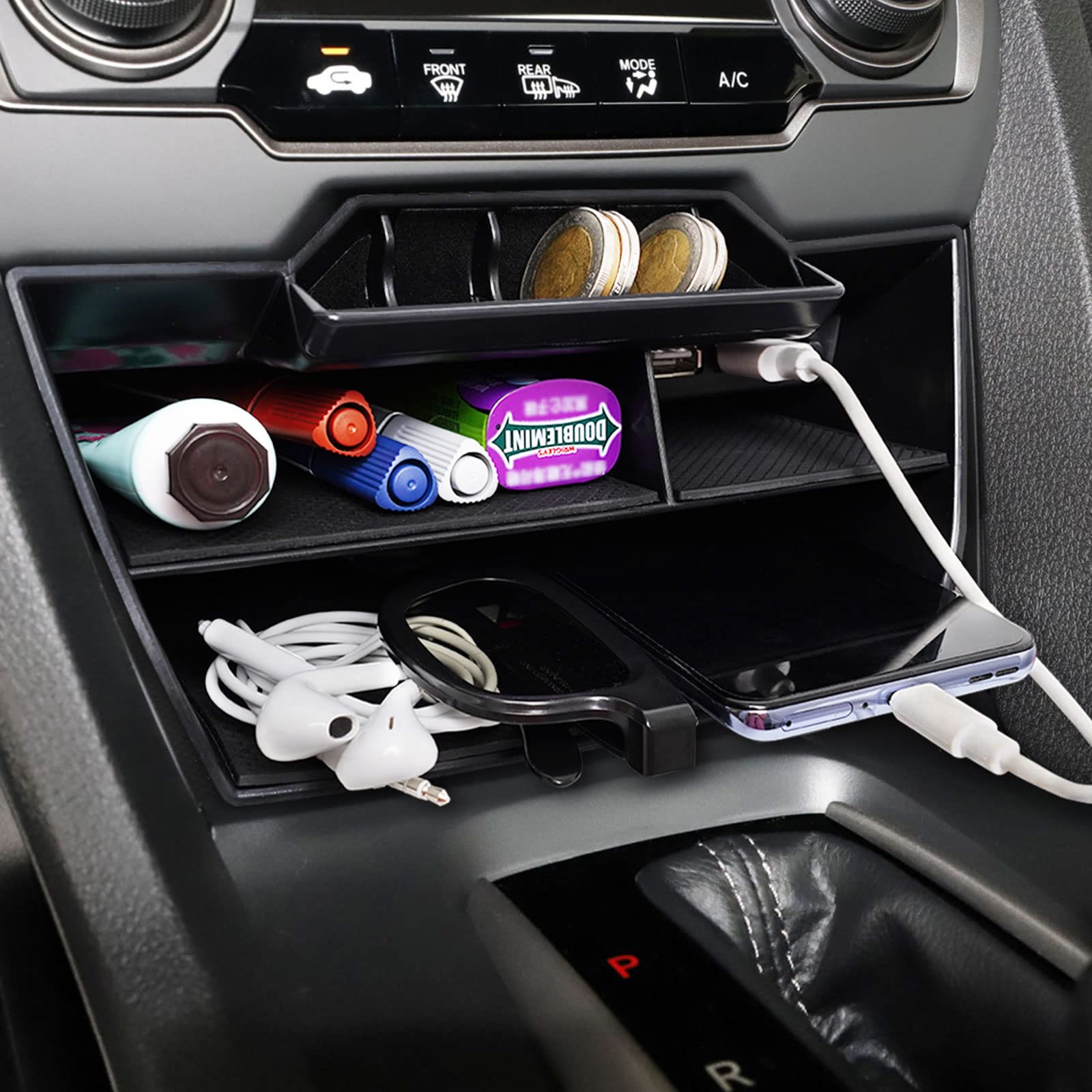 CarQiWireless open armrest hidden storage illustrating secure concealed compartment