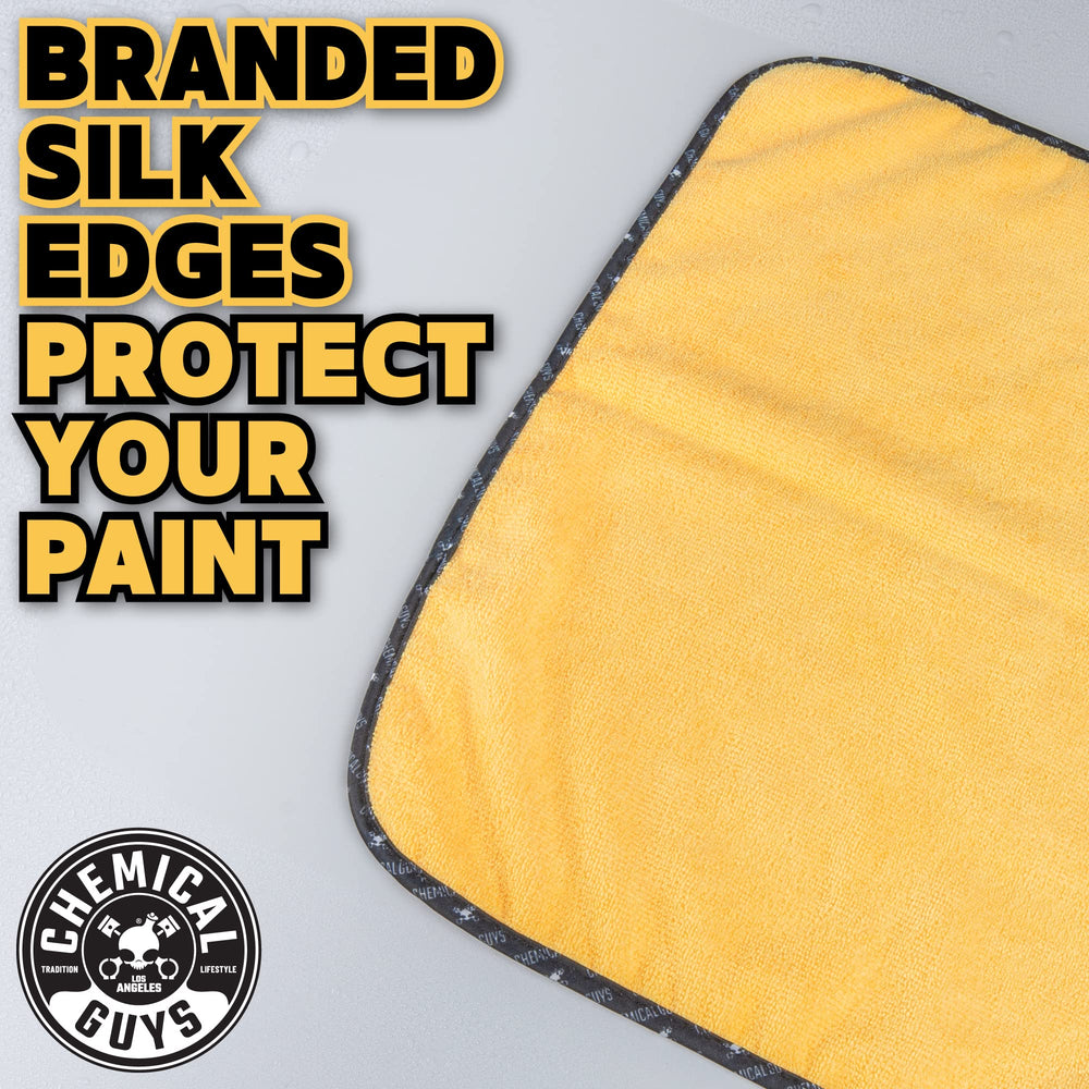 Chemical Guys towel polishing glass to a clear, streak-free shine