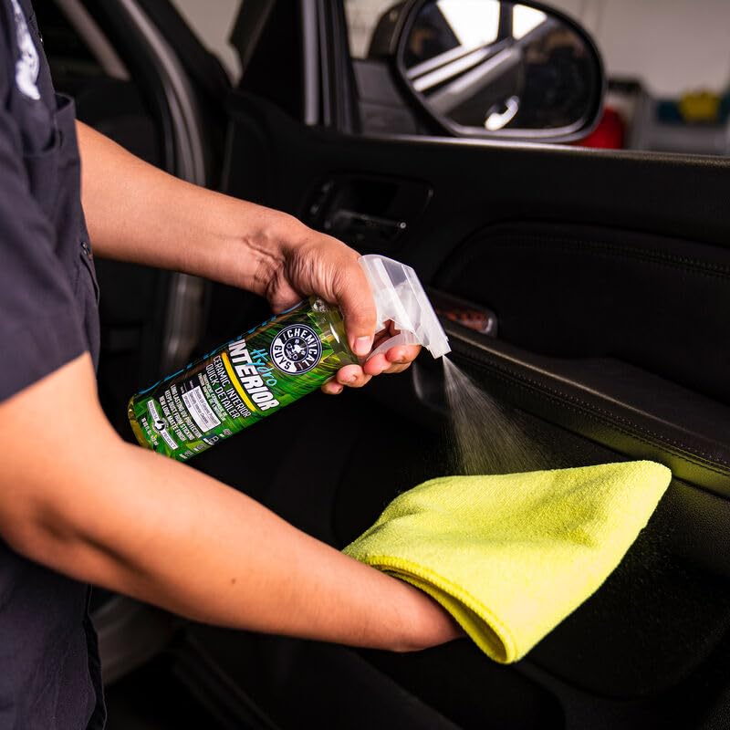 Chemical Guys HydroInterior 16 oz bottle next to towel showing scale and convenient size