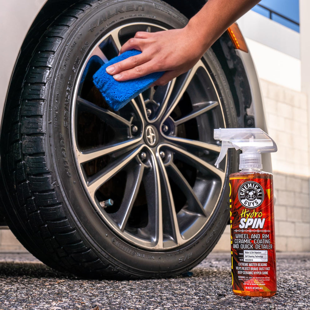 Chemical Guys HydroSpin bottle on a garage workbench in lifestyle setting for practical detailing use