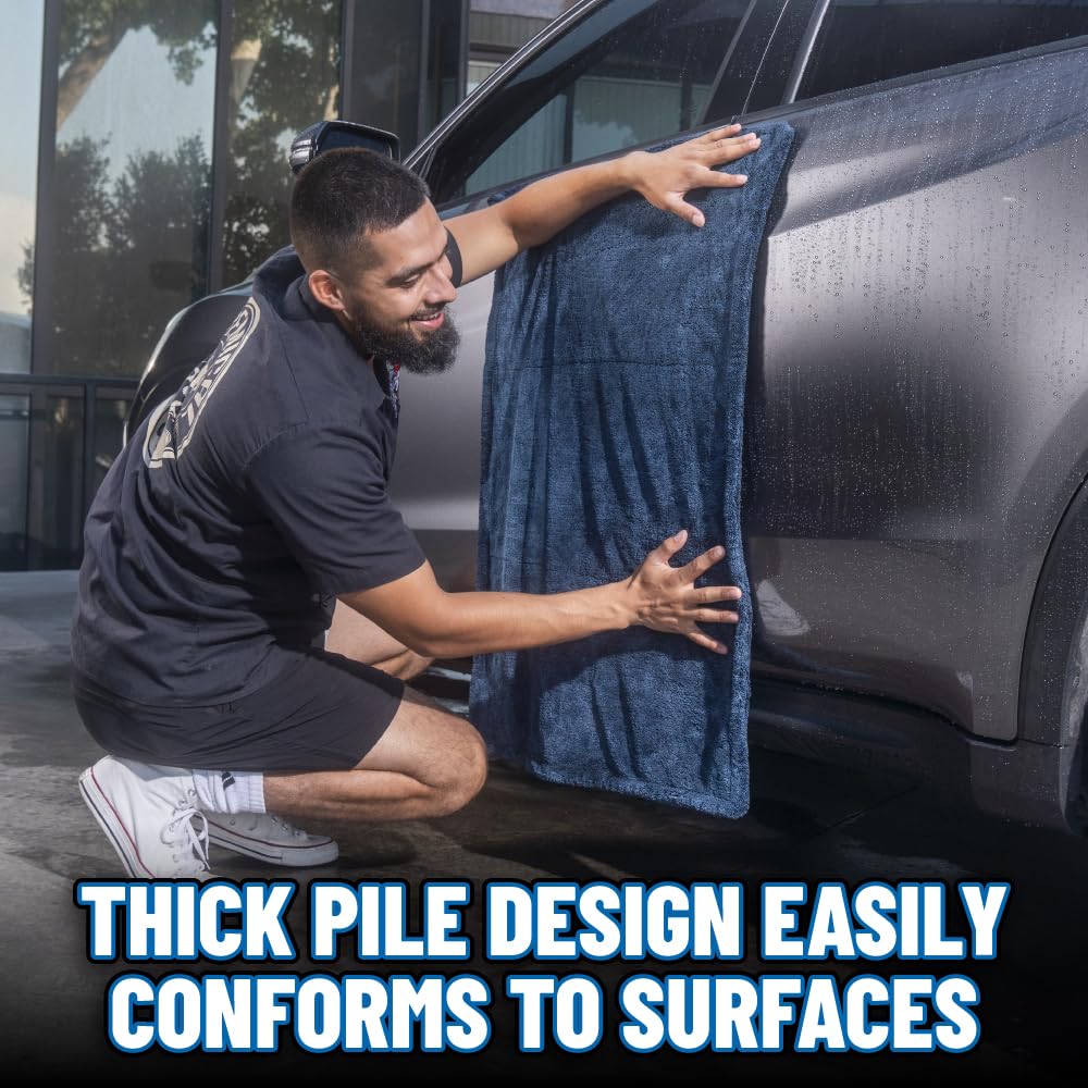 Chemical Guys towel in use drying a sedan roof for streak-free results