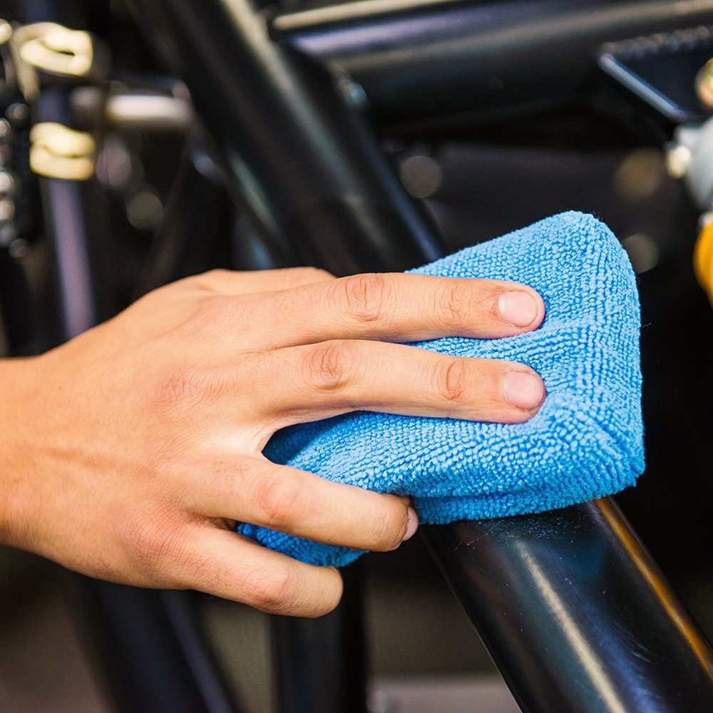 Chemical Guys pad spreading wax on car hood for streak-free finish