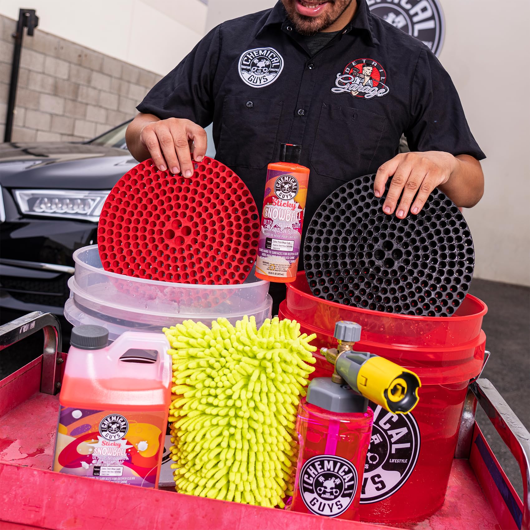 Chemical Guys foam on car panel showing safe encapsulation of dirt and glossy finish