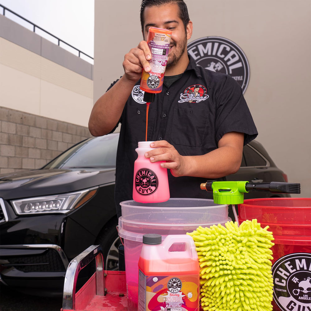 Chemical Guys 16 oz bottle next to common objects to show compact size