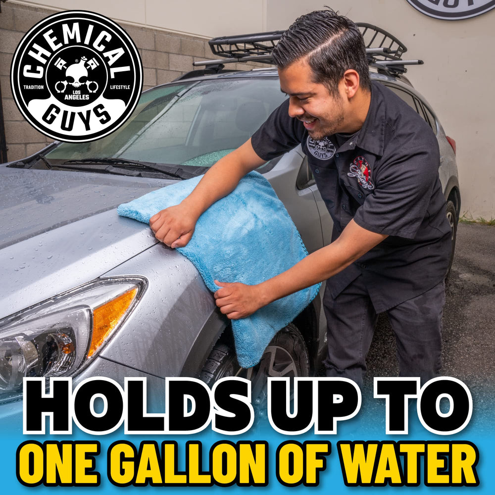 Chemical Guys towel wiping glass and chrome, highlighting safe use on multiple surfaces
