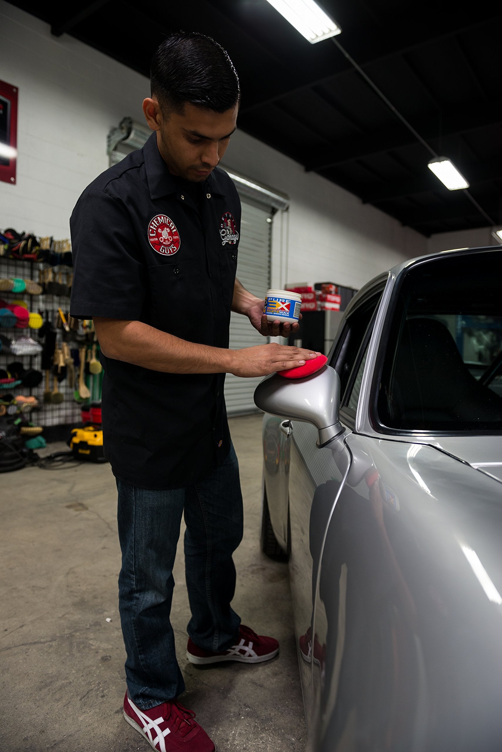 Chemical Guys buffed panel revealing deep wet gloss and enhanced light reflection