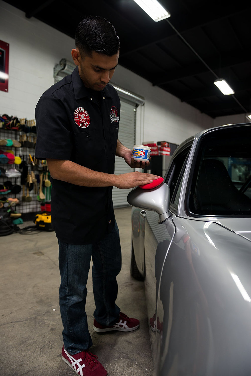 Chemical Guys buffed panel revealing deep wet gloss and enhanced light reflection
