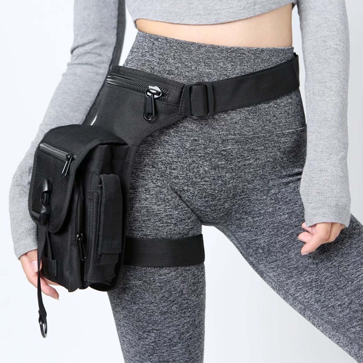 chrisdien deny front view of black thigh bag showing slim profile and pockets, great for quick access