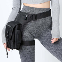 chrisdien deny front view of black thigh bag showing slim profile and pockets, great for quick access