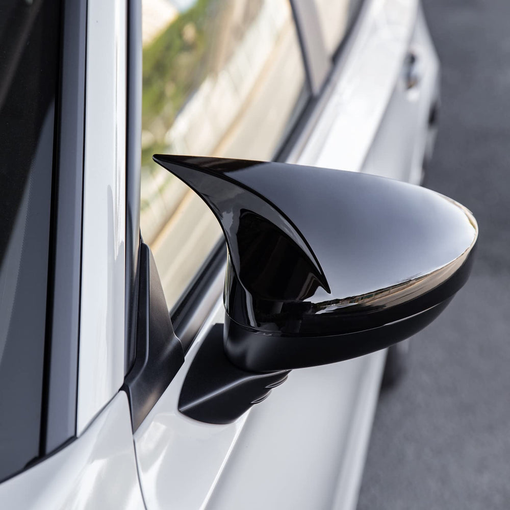 CKE mirror cover held by hand illustrating lightweight fit and scale