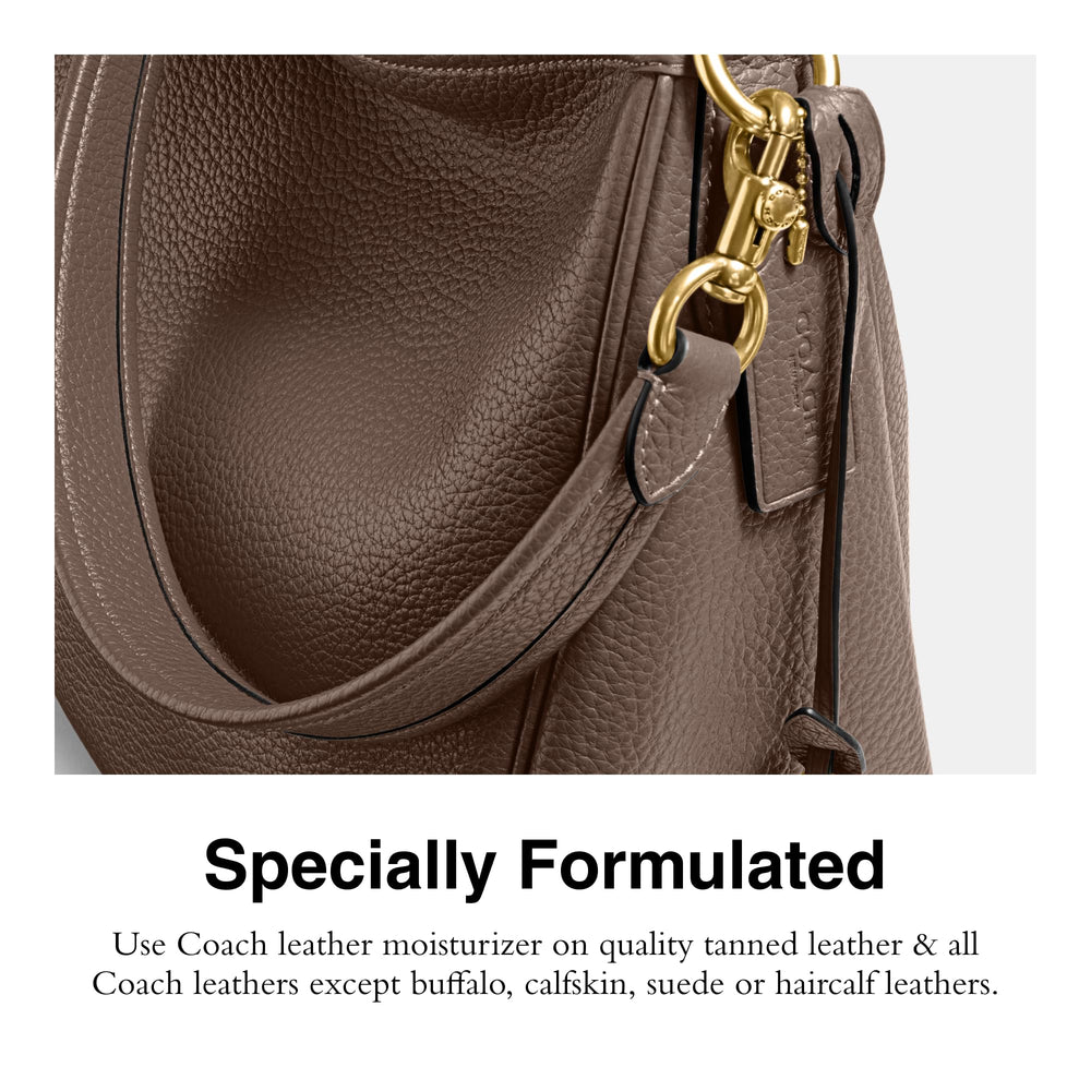 Applying Coach leather moisturizer with soft cloth to restore supple leather effectively