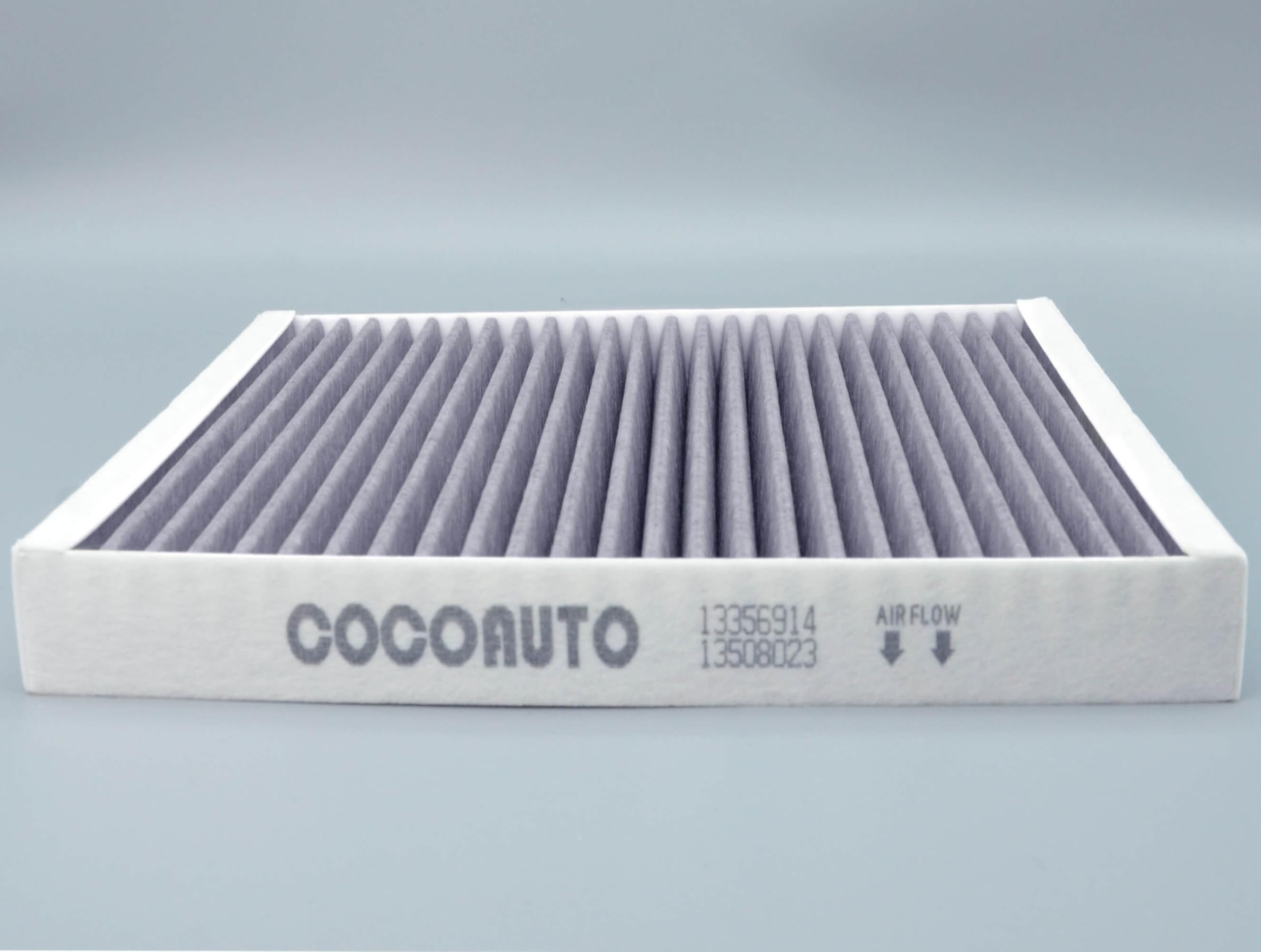 COCOAUTO cabin filter being inserted into HVAC slot reducing dust and odors for passengers