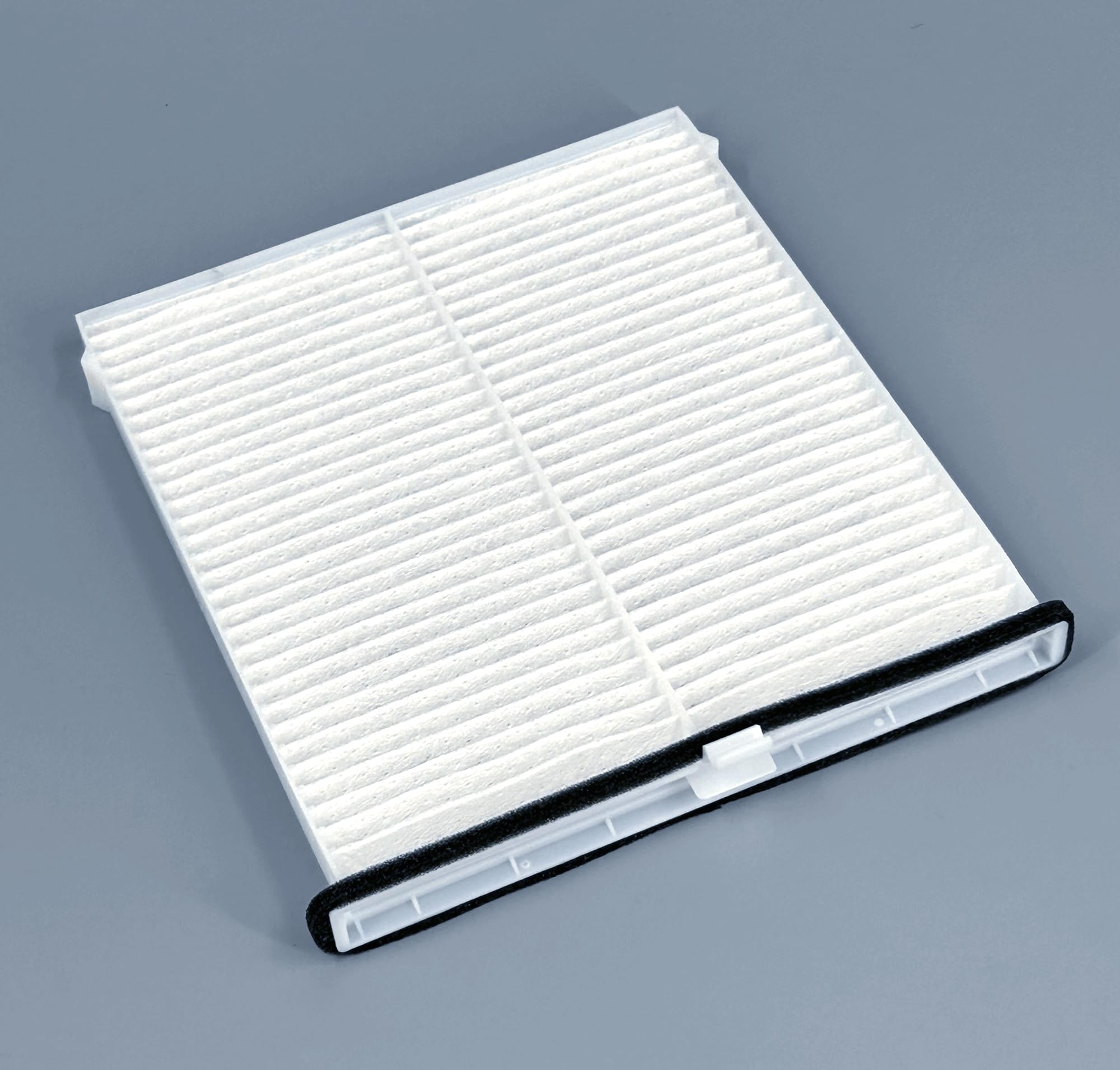 COCOAUTO filter beside ruler showing compact size for fit confirmation