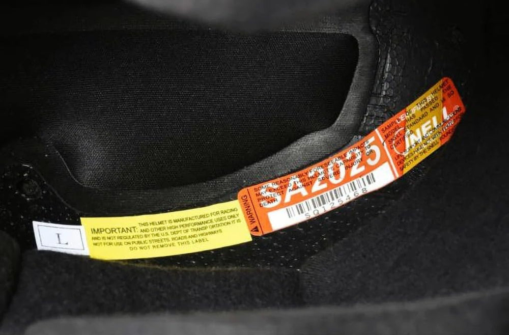 Conquer helmet worn on racetrack showing real-world fit and confidence benefit