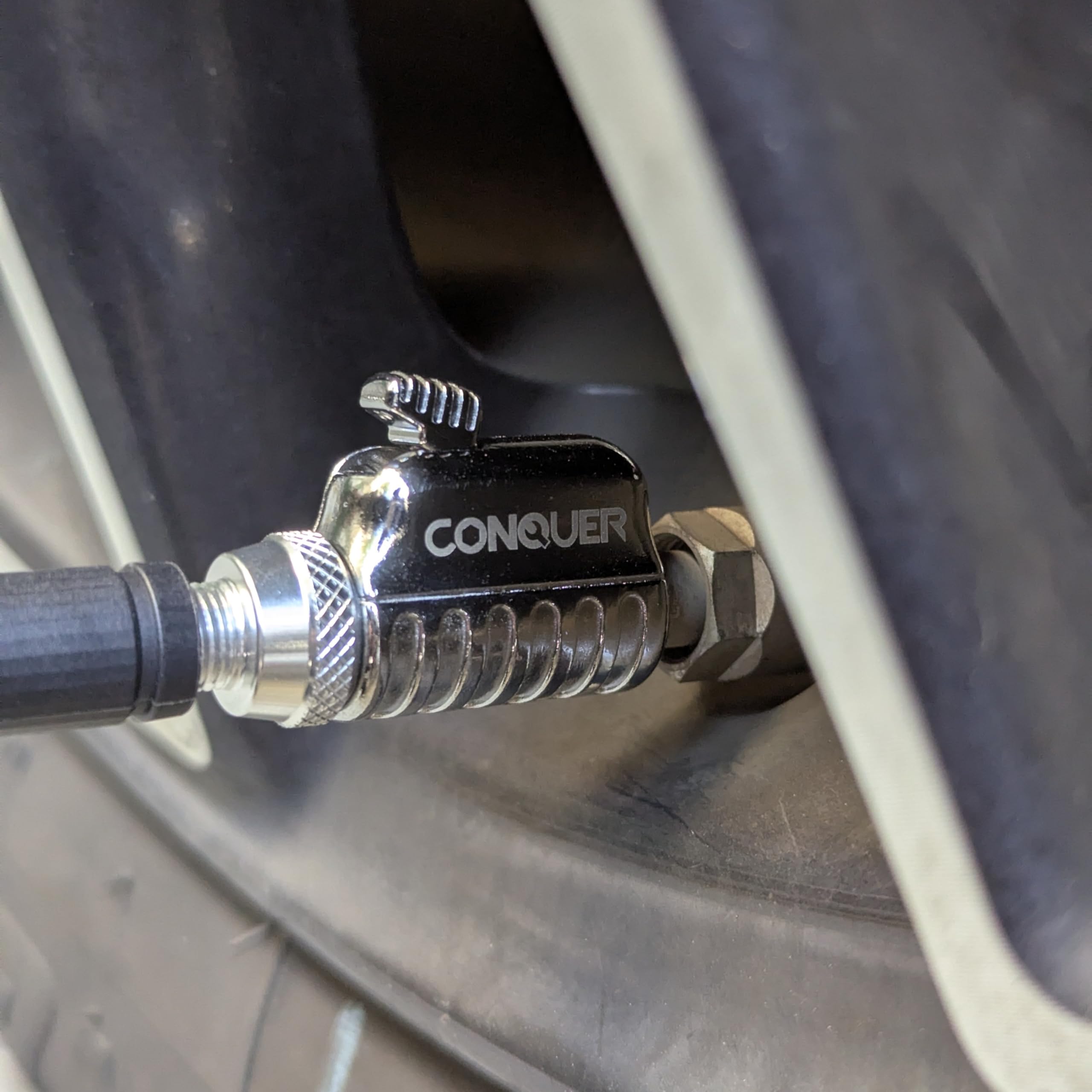 CONQUER on a workbench illustrating heavy-duty build for daily use