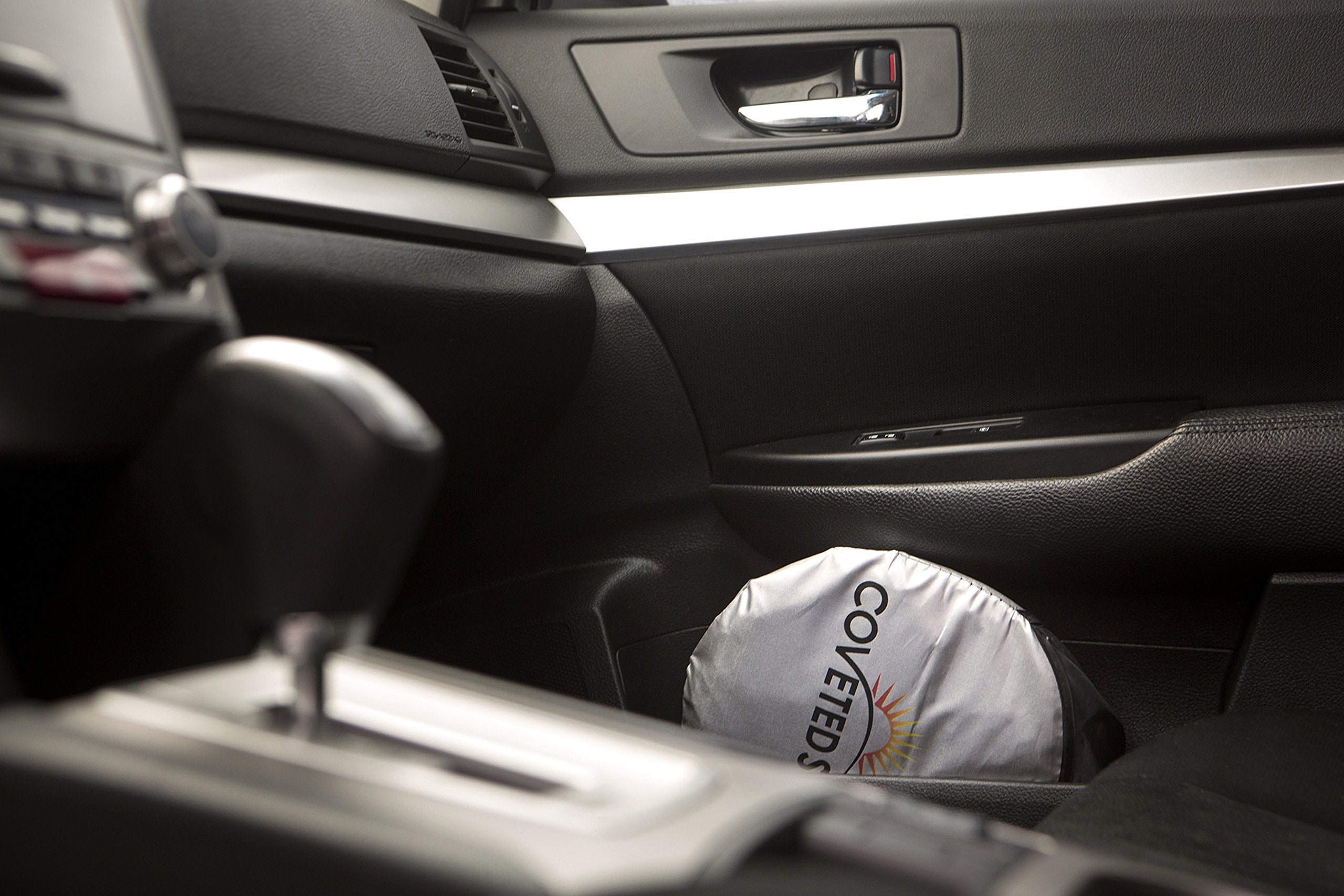 Coveted Shade installed inside a minivan windshield demonstrating fit and sun protection