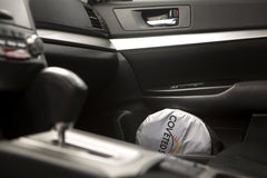 Coveted Shade installed inside a minivan windshield demonstrating fit and sun protection