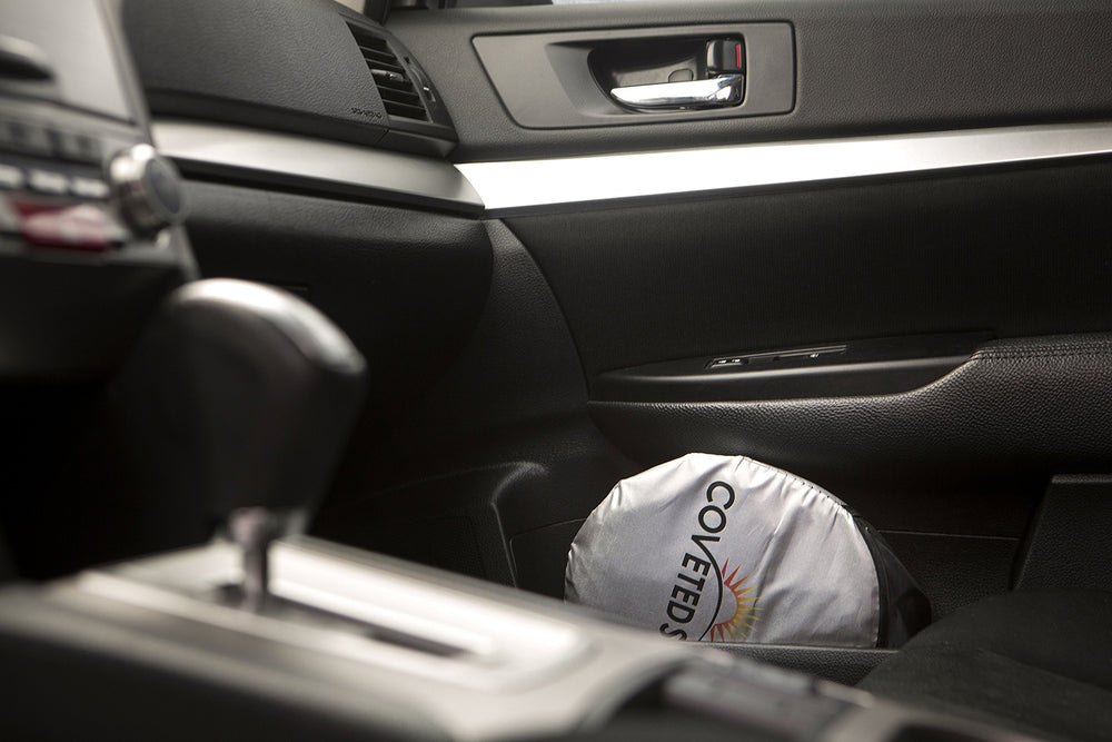 Coveted Shade in a parked car under bright sun illustrating heat reduction benefit
