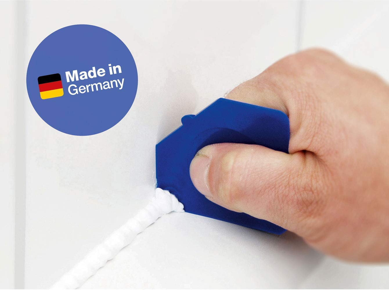 Cramer tool in use smoothing fresh silicone for a tidy finished seam
