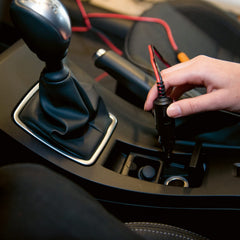 CTEK Cig-Plug installed in car interior demonstrating convenient charger access