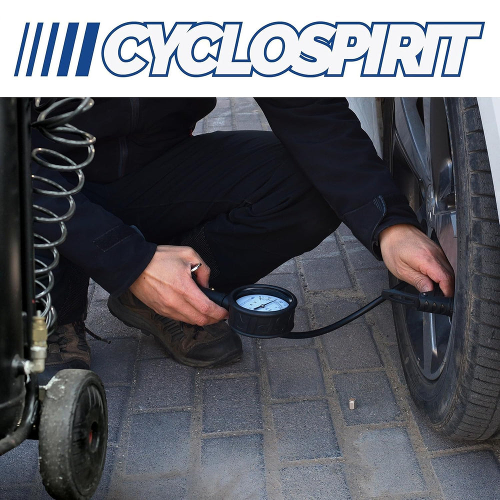 CycloSpirit inflator on a workbench next to a bicycle tire showing workshop-ready reliability