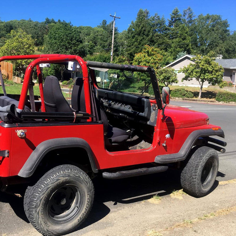 DenForste lifestyle image of mirrors on Jeep driving open-road for safety